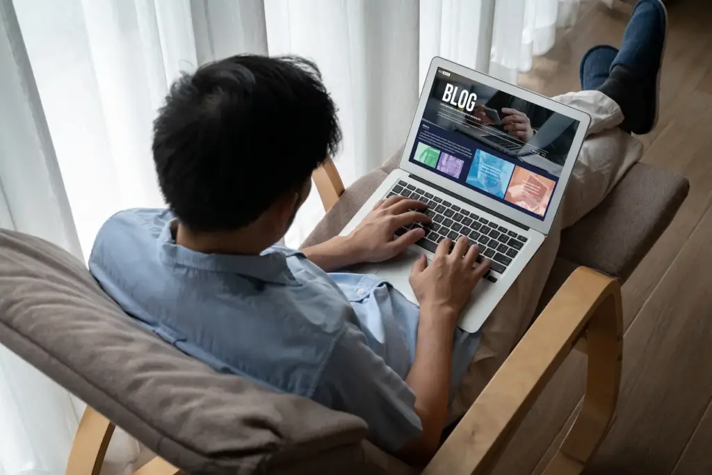 Person Using a Laptop to Create a Blog 